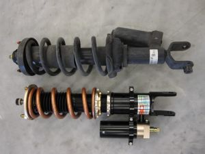 Rear ER suspension with 10kg Swift Spring next to factory rear suspension with stock external reservoir!