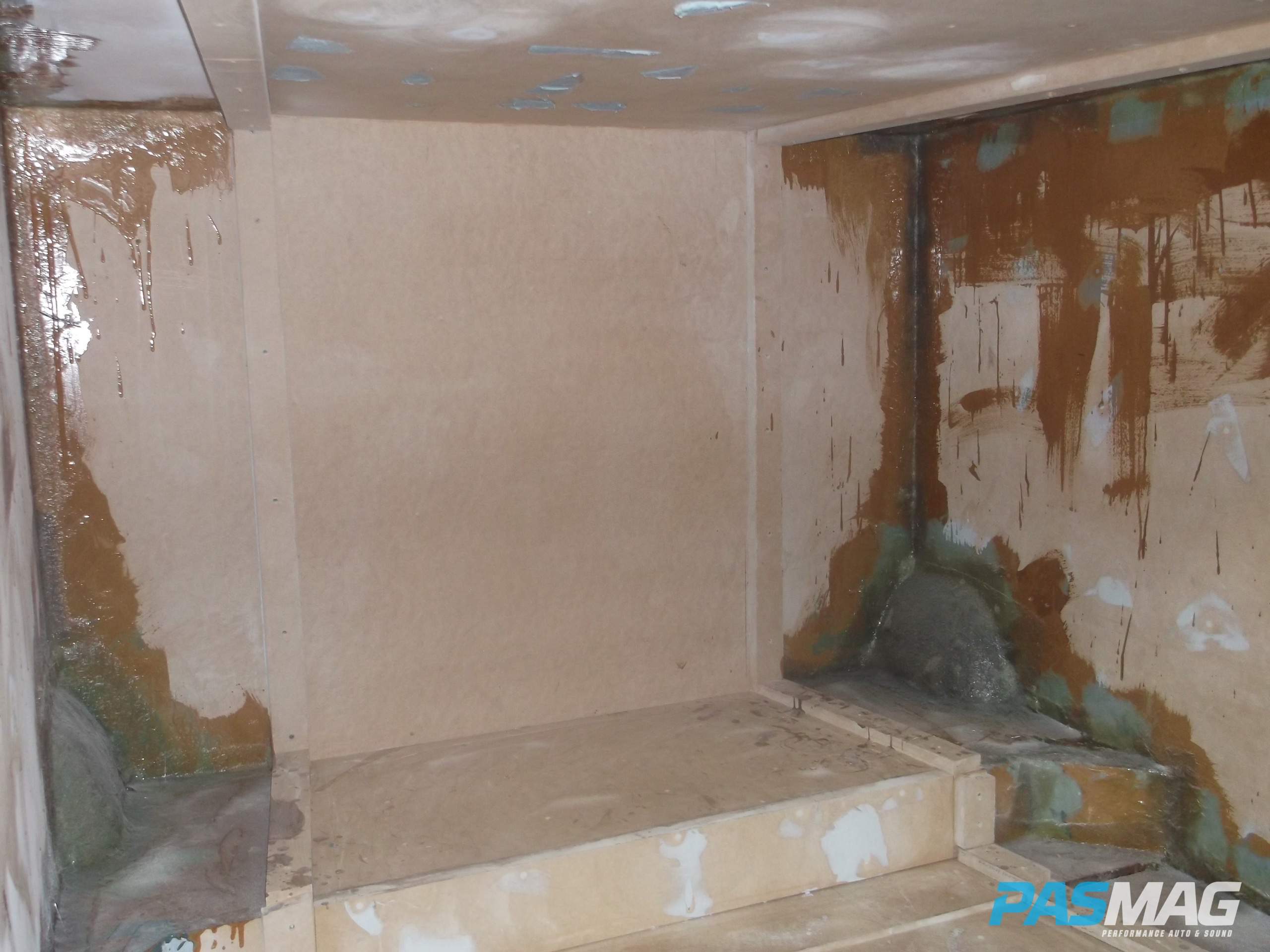 applying resin to seams and corners of enclosure