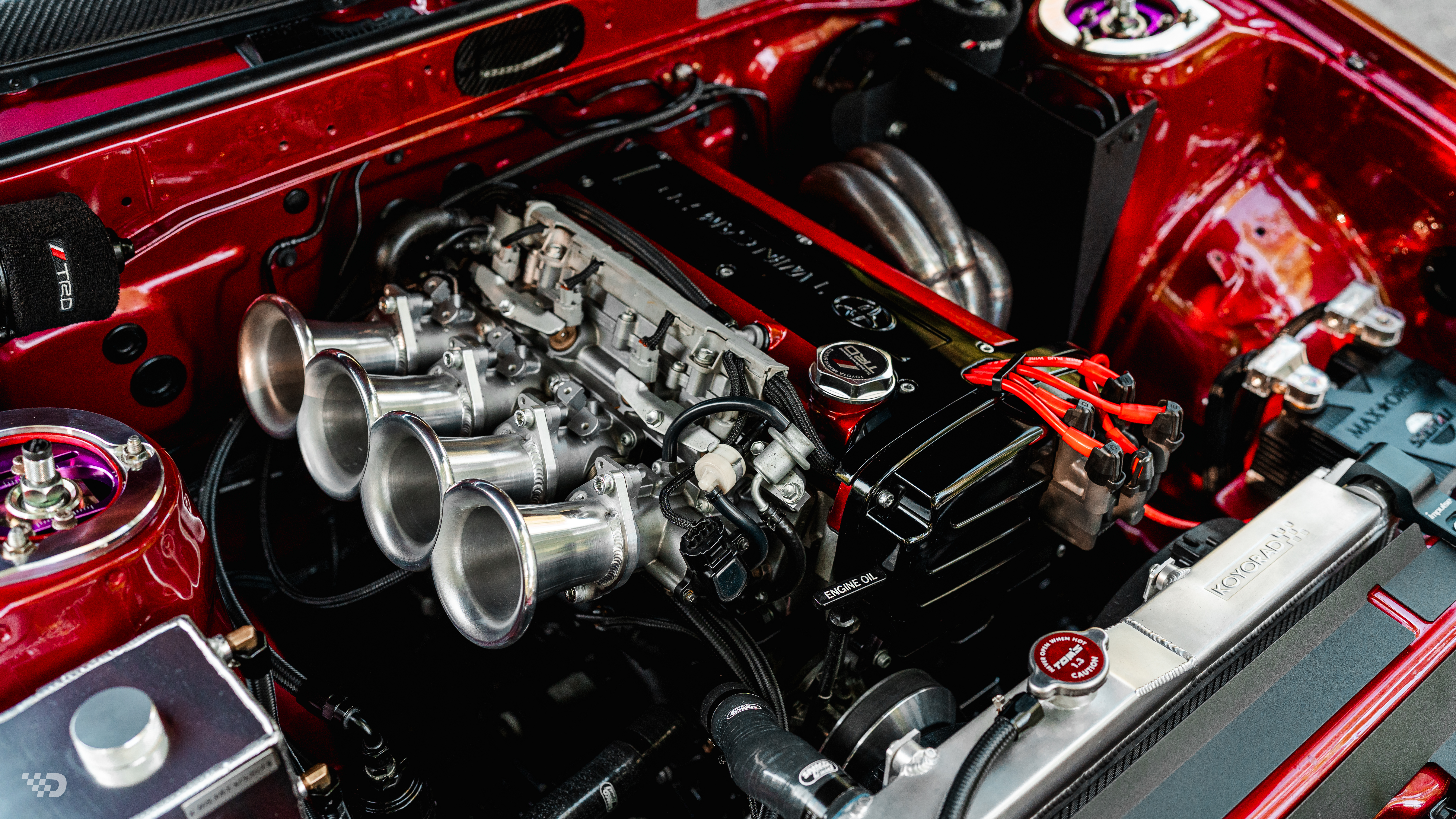 Wide engine bay shot of AE86 with 4AGE Blacktop 20V and individual throttle bodies.