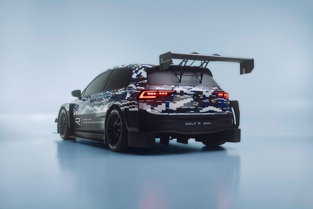 Camouflaged Volkswagen Golf R 24H race car concept shown from the rear three-quarter angle with a large rear wing and widebody aero.