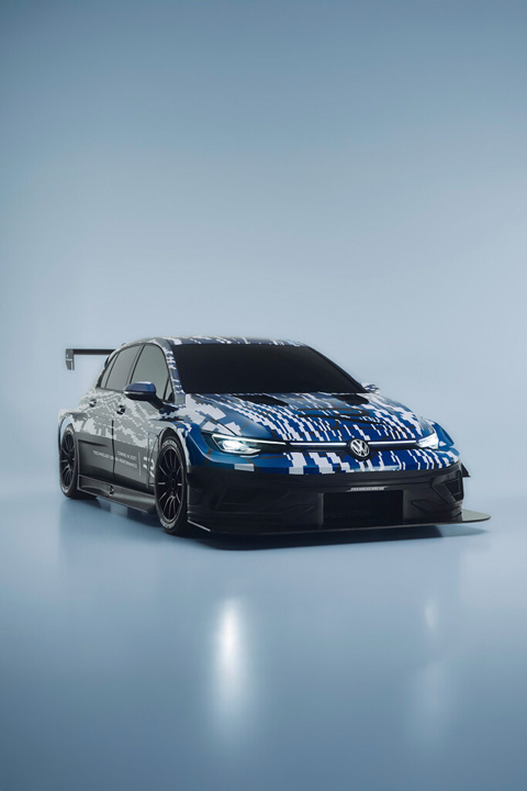 Camouflaged Volkswagen Golf R race car concept shown from the front three-quarter angle with Nürburgring-inspired aerodynamic bodywork.