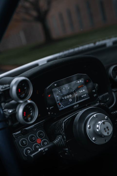 AiM MXS Strada digital dash and aftermarket steering wheel setup inside Aum Sung’s 1992 Lexus SC400.