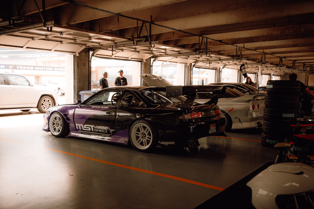 Professional drift drivers performing tandem runs at FuelFest Dallas-Fort Worth.