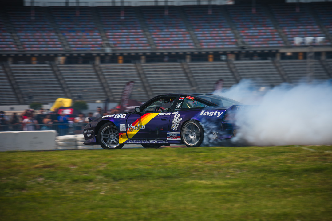 Modified performance vehicle displayed inside Texas Motor Speedway during FuelFest Dallas-Fort Worth.