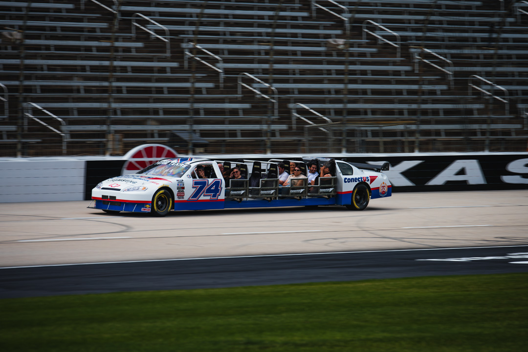 Custom stretch stock car carrying FuelFest attendees around Texas Motor Speedway during the Dallas-Fort Worth event.