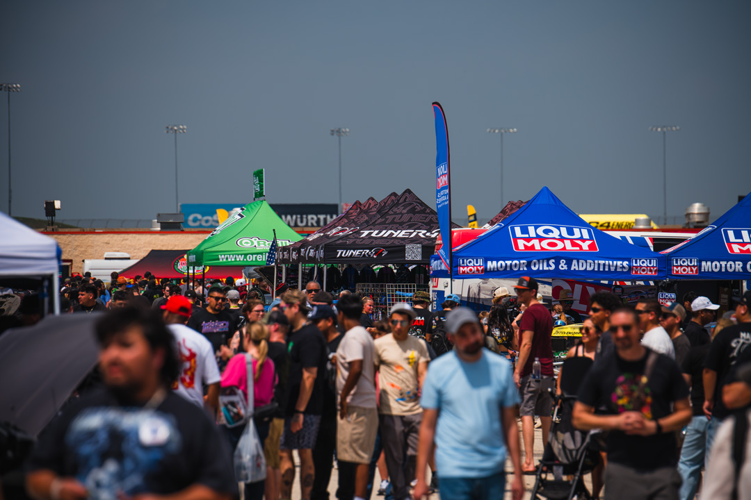 Crowds moving through the vendor and sponsor midway during FuelFest Dallas-Fort Worth at Texas Motor Speedway.