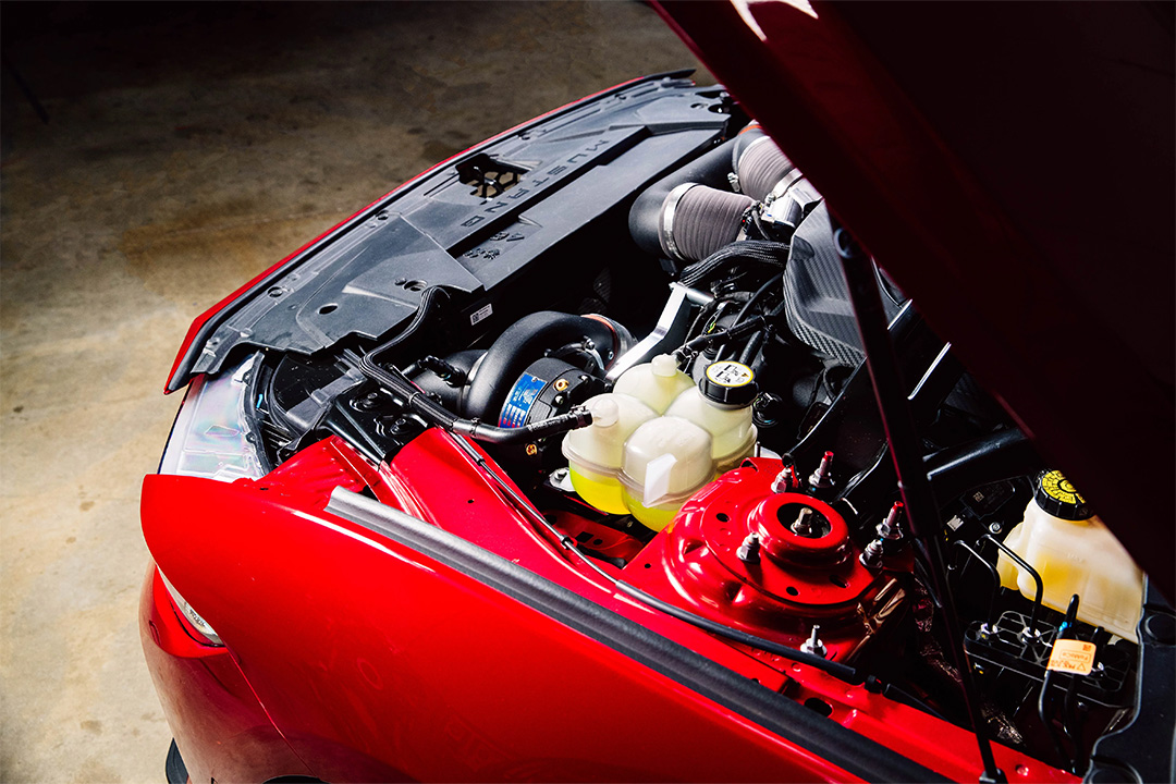 Close-up view of the Vortech supercharger system installed in a 2024-2026 Ford Mustang GT engine bay.
