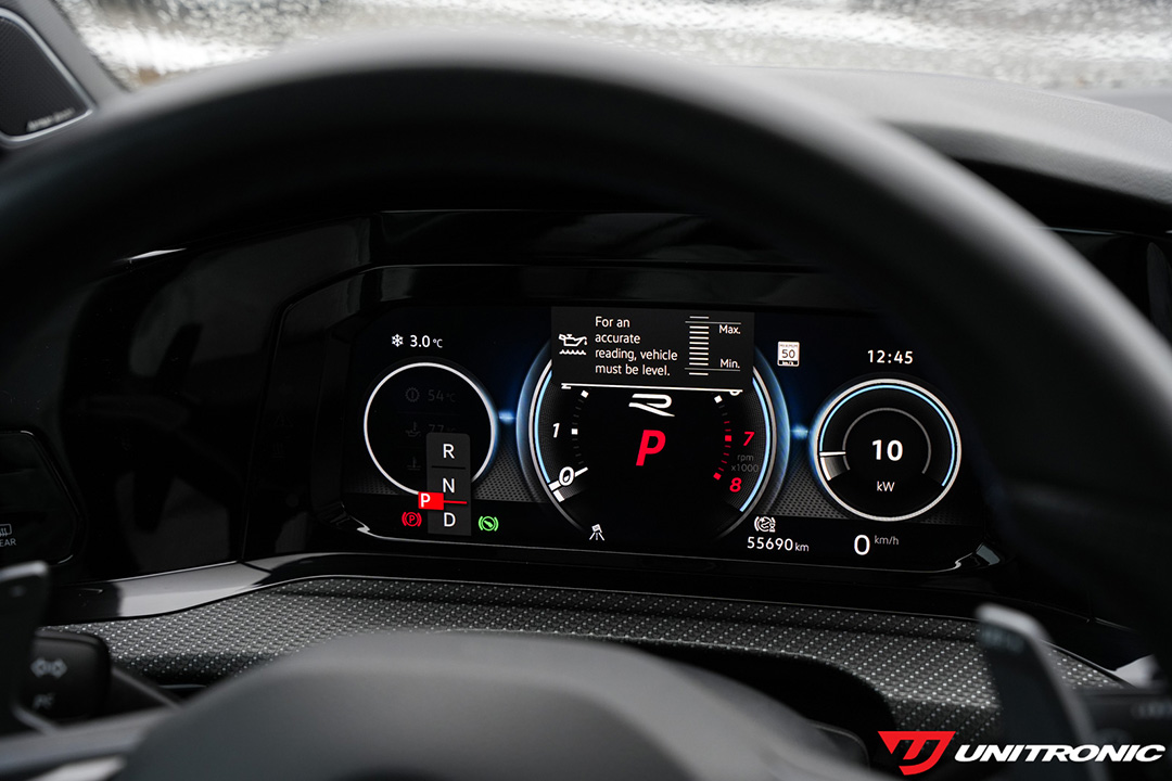 Volkswagen Golf R digital gauge cluster showing engine oil level status and vehicle level warning with Unitronic branding.