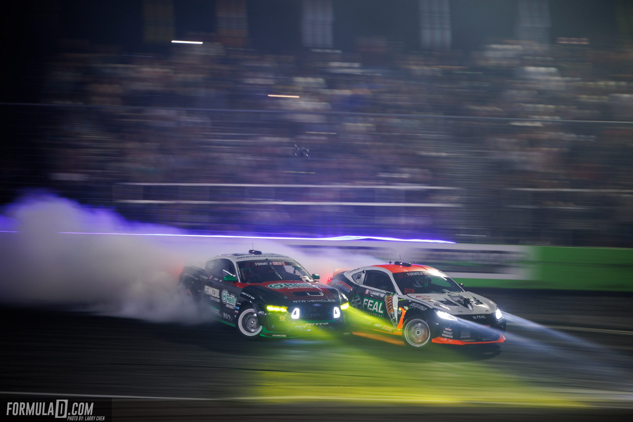 Aurimas “Odi” Bakchis and James Deane battle during Formula Drift Orlando at Orlando Speed World.