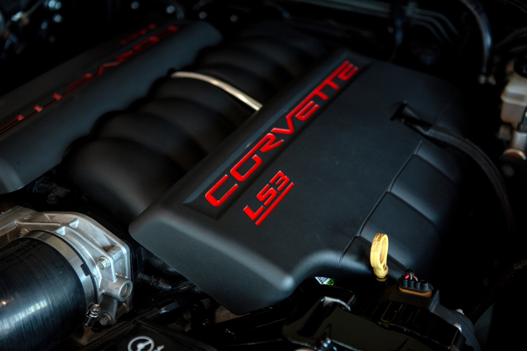 Jon Erickson’s red LS-swapped 2011 Subaru STi with widebody aero and track-focused details.
