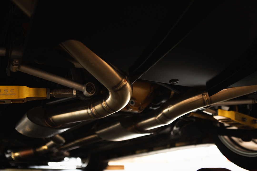 Jon Erickson’s red LS-swapped 2011 Subaru STi with widebody aero and track-focused details.