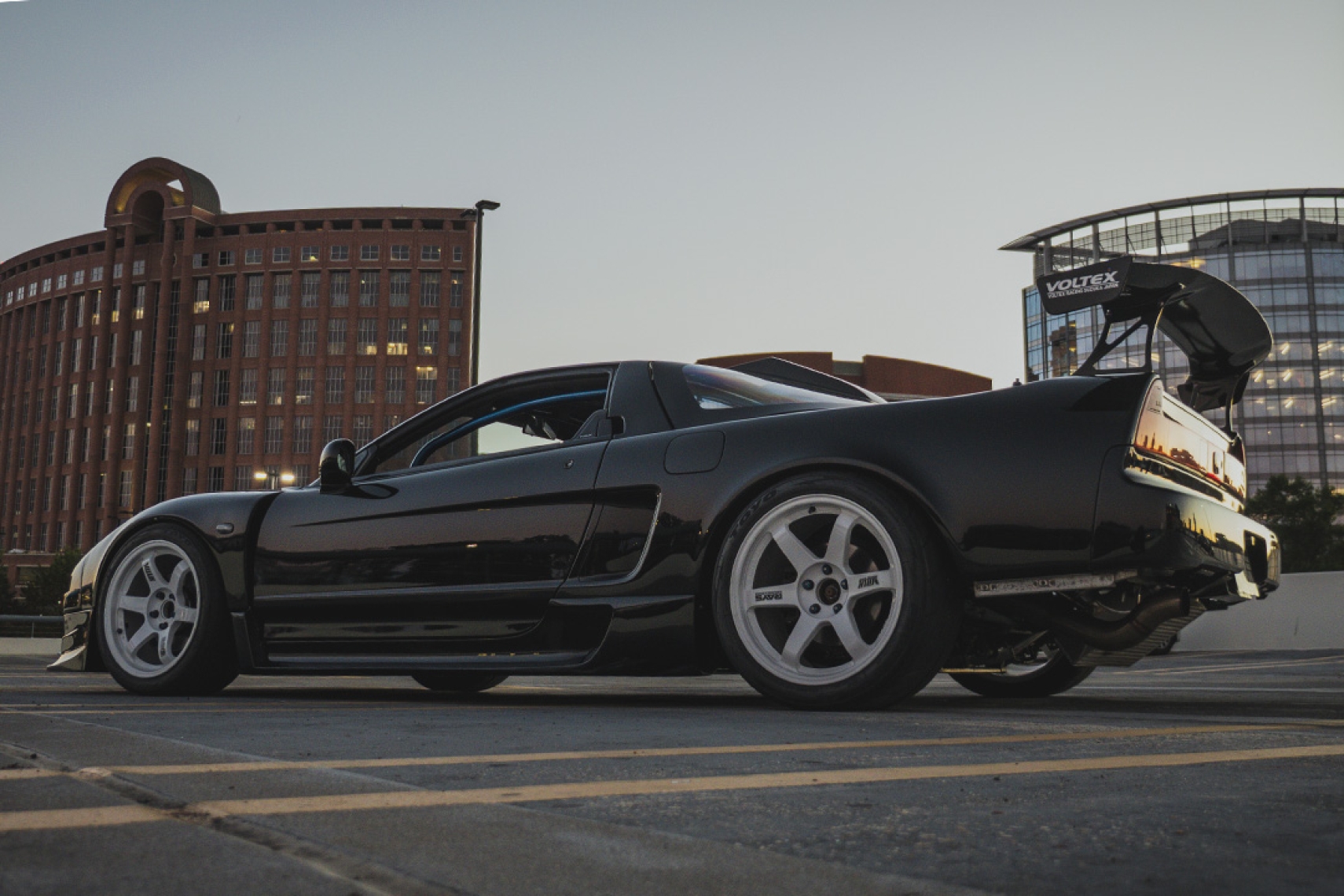 Peter Doan’s black 1991 Honda NSX parked in a rooftop garage with white Volk Racing TE37 wheels and a Voltex rear wing.