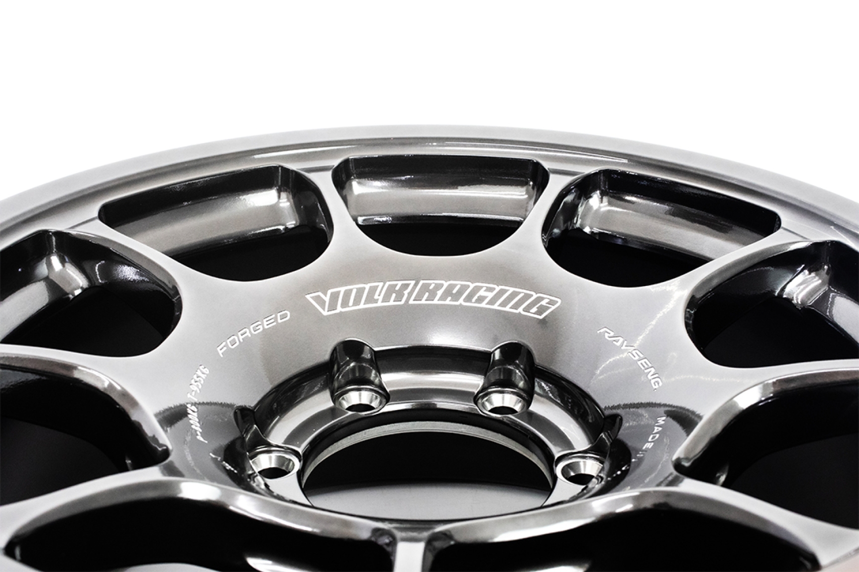 Close-up of the RAYS VOLK Racing ZE40X wheel in the Shining Light Metal finish showing the forged center section and spoke details.