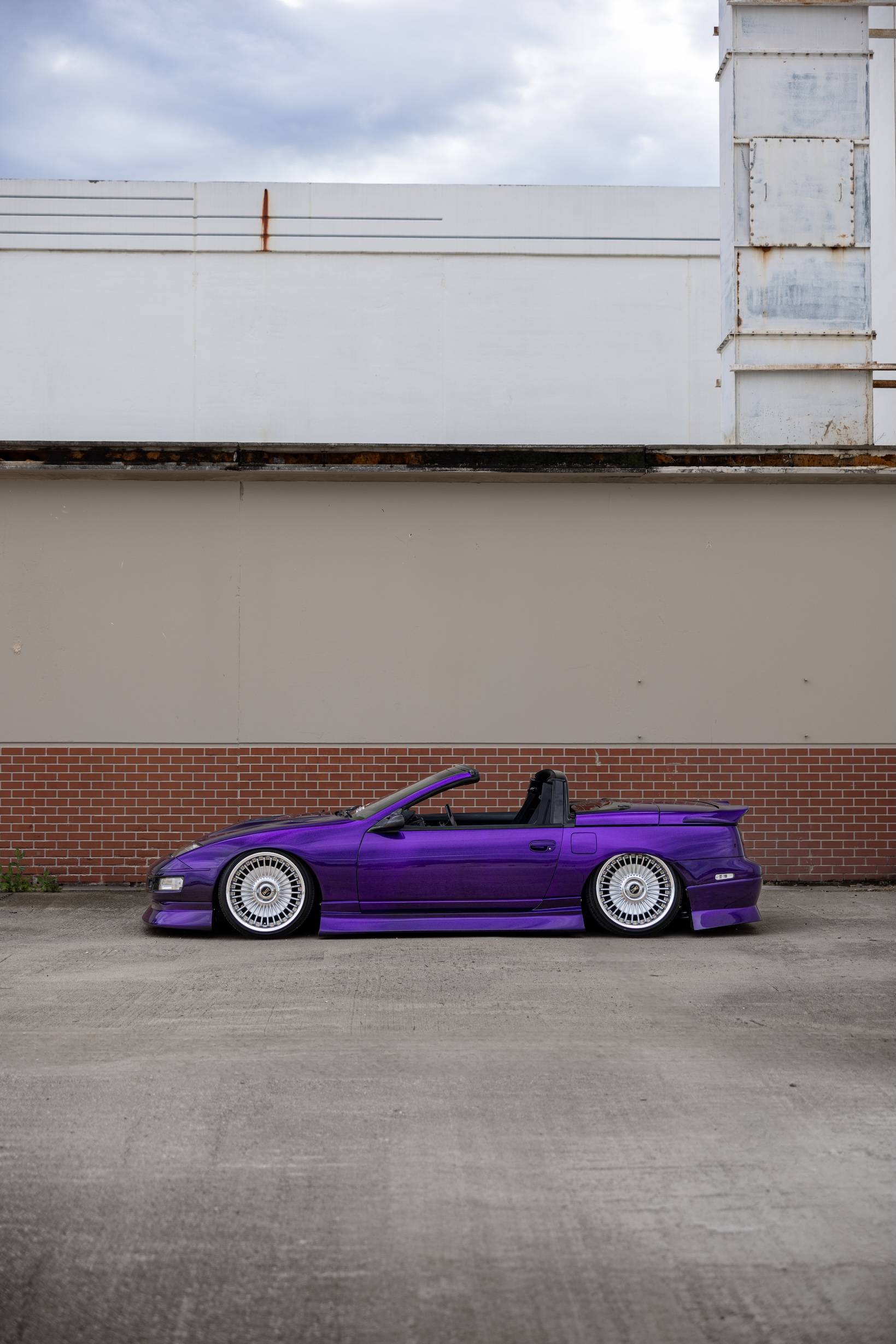 Alex Hammond’s purple 1993 Nissan 300ZX Convertible with carbon-fiber details, custom aero, low stance, and detailed interior upgrades.