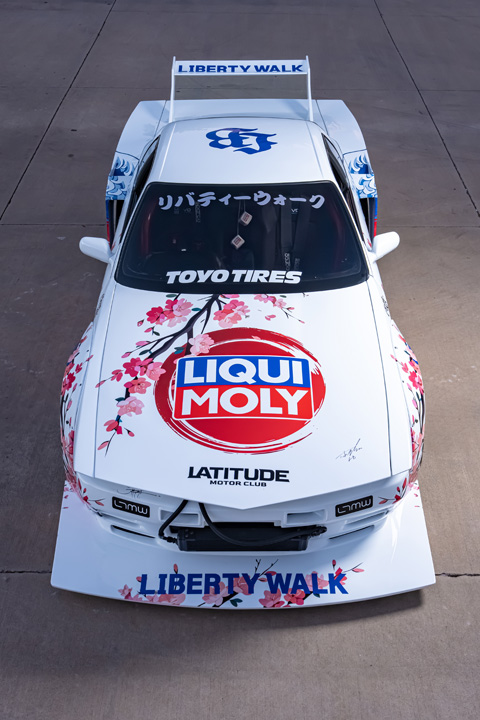Osmond Seangsuwan’s 1990 Nissan Skyline GT-R with Liberty Walk LB-Kaido widebody aero, LIQUI MOLY livery, Rohana wheels, Toyo tires, RB26 power, carbon interior, and Japanese-inspired artwork.