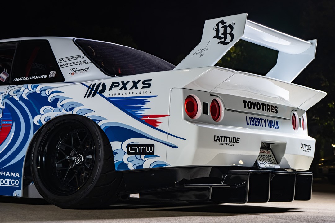 Osmond Seangsuwan’s 1990 Nissan Skyline GT-R with Liberty Walk LB-Kaido widebody aero, LIQUI MOLY livery, Rohana wheels, Toyo tires, RB26 power, carbon interior, and Japanese-inspired artwork.