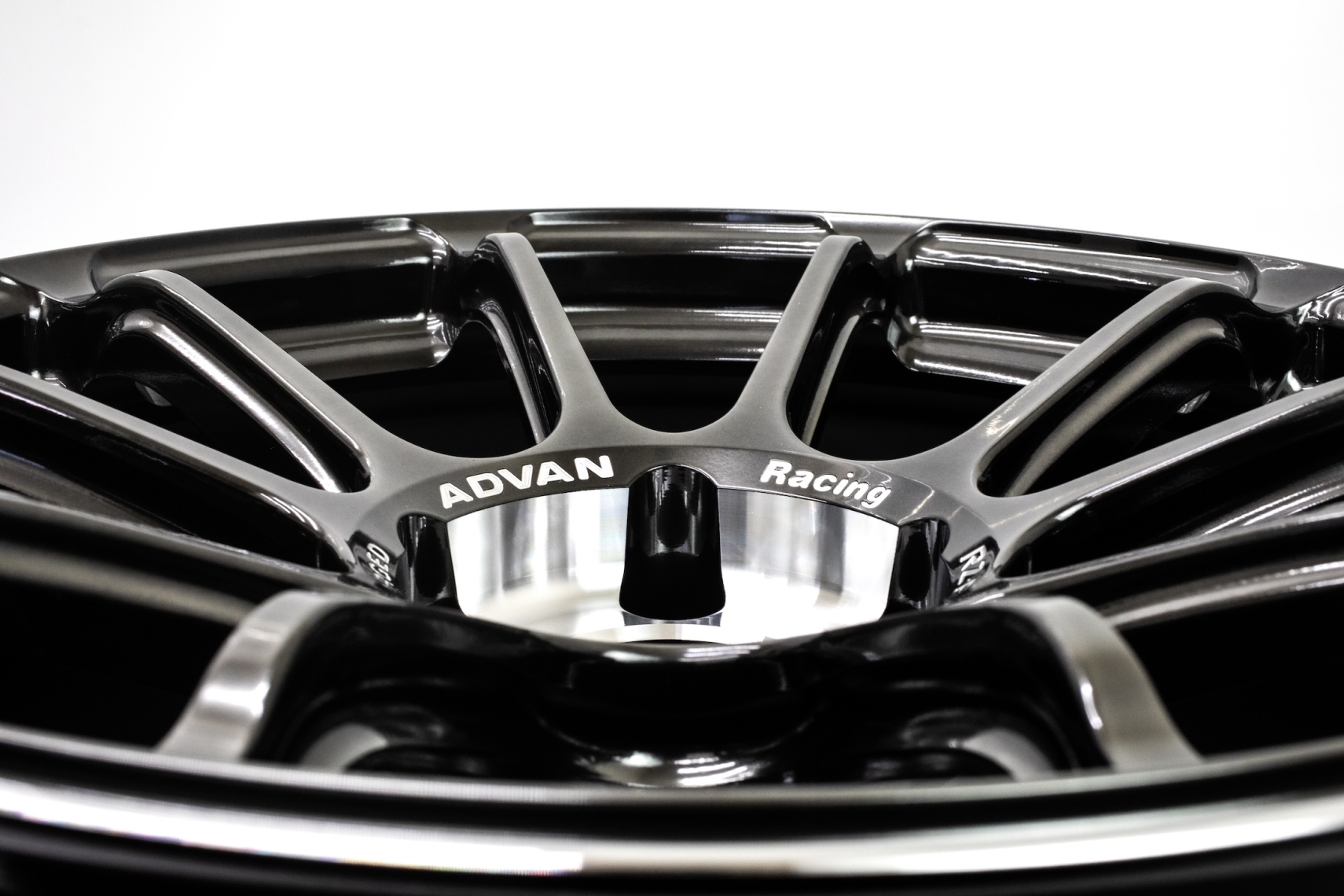 Close-up of the ADVAN Racing RZ-F3 forged wheel showing the multi-spoke design, center section, and ADVAN Racing branding.
