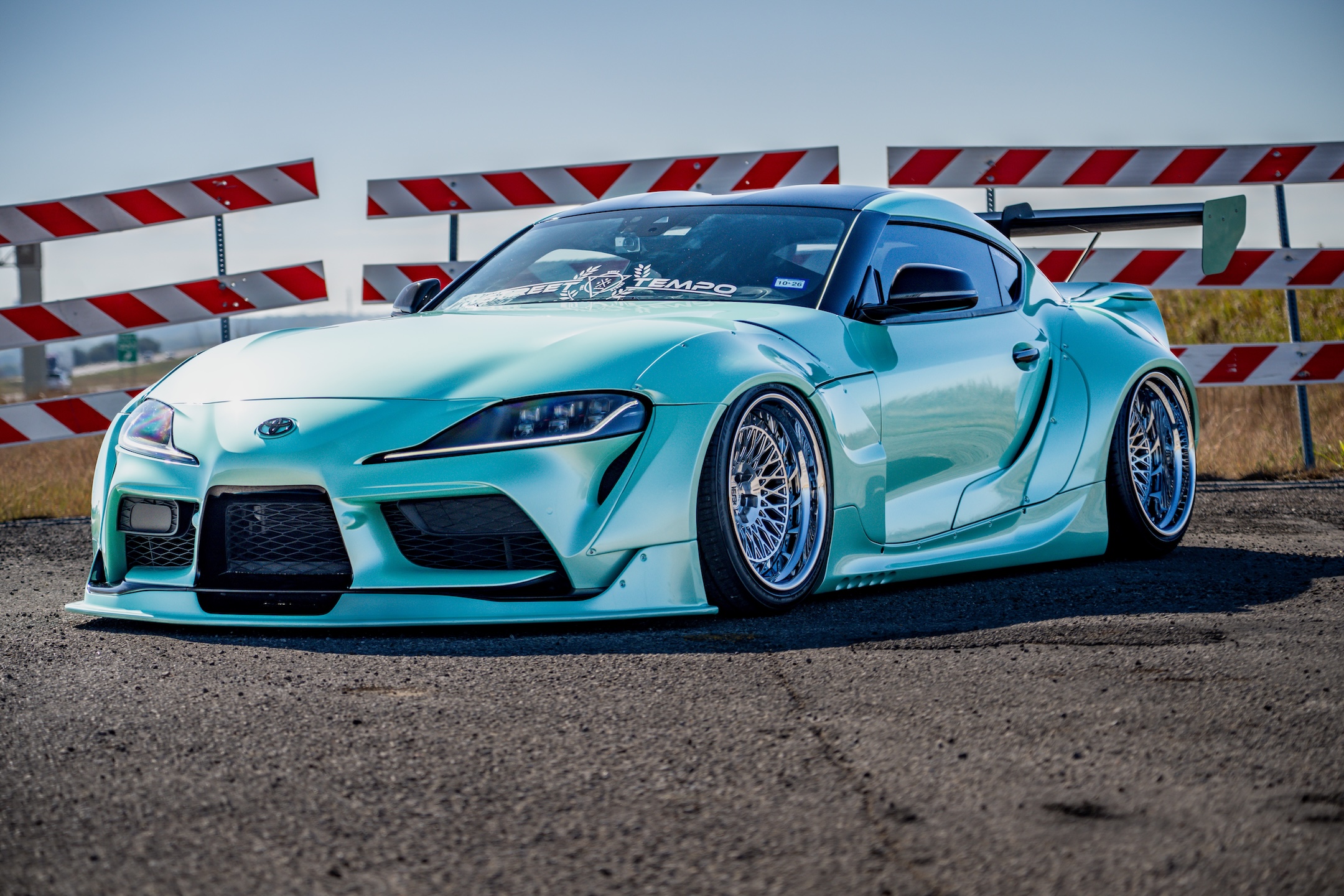 Bryan Miguel’s 2021 Toyota GR Supra with Pandem widebody and Intriket Solutions Maestro II forged wheels in a front three-quarter view.
