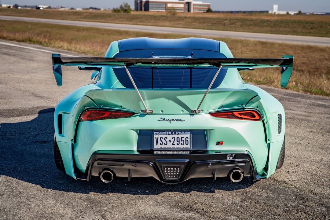 Rear view of Bryan Miguel’s 2021 Toyota GR Supra showing its Pandem bodywork and large rear wing.