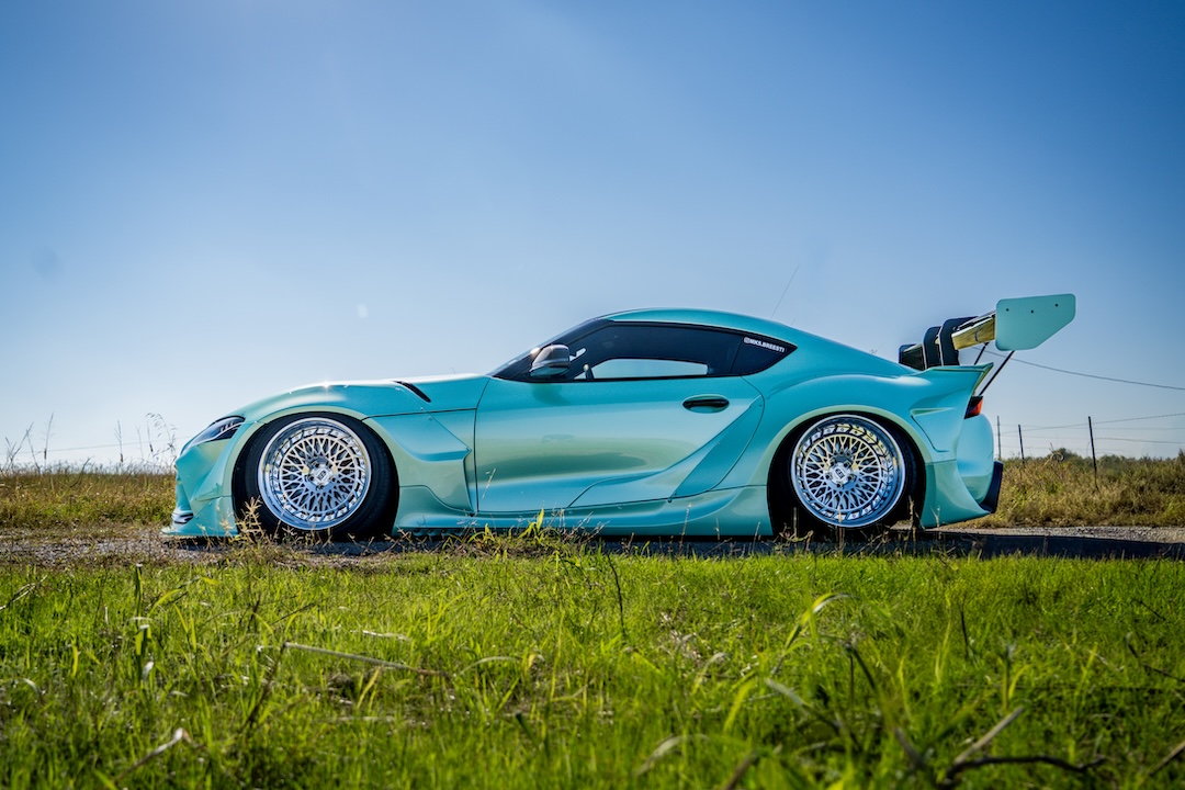 Side profile of Bryan Miguel’s 2021 Toyota GR Supra showing its Pandem bodywork, AirLift stance and Intriket Solutions Maestro II forged wheels.