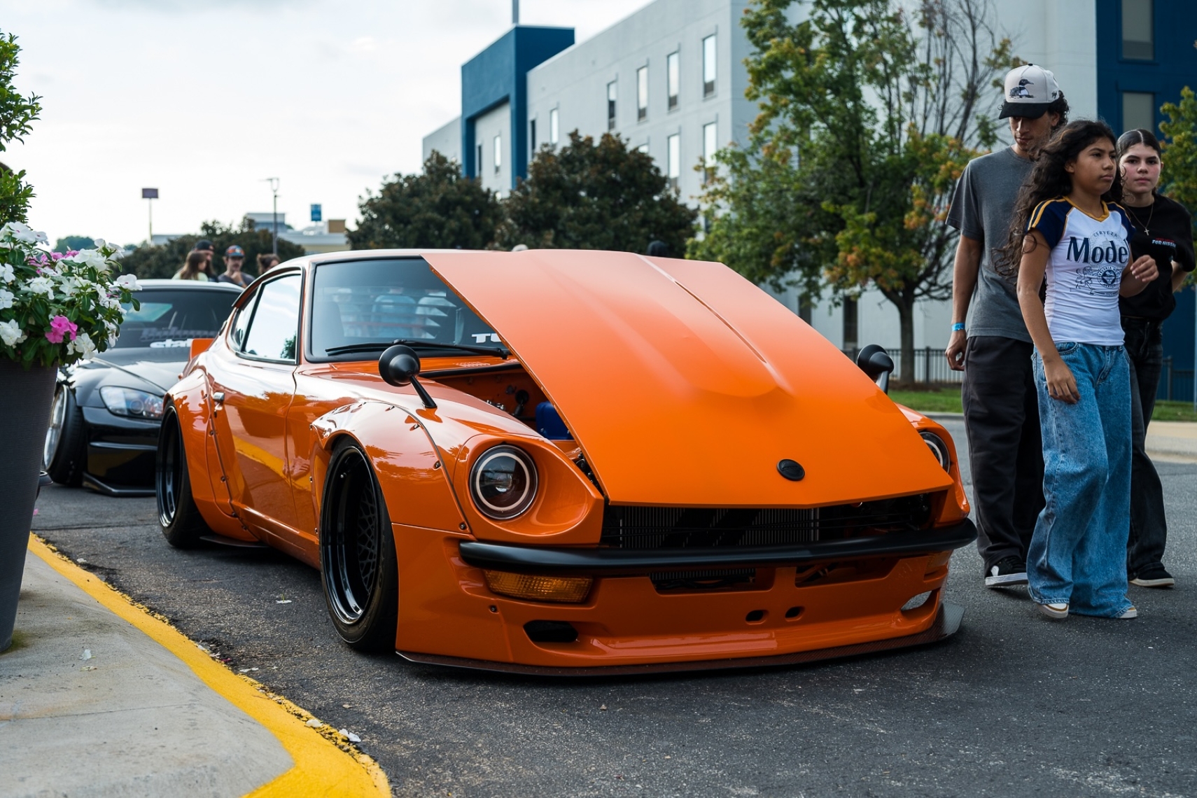 Orange Datsun on display at Team Tensei’s 2026 Daikoku Tensei Style event in Hickory, North Carolina.