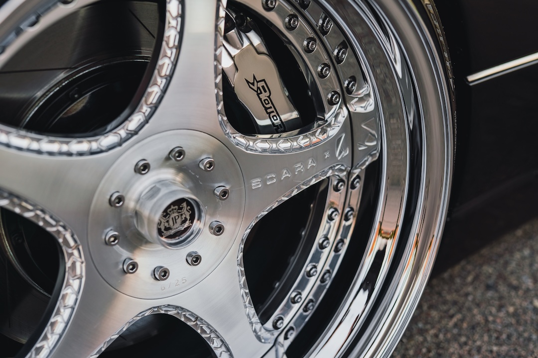 Close-up of a Luxury Abstract x Junction Produce Scara wheel and Rotora four-piston brake caliper on Kyle Harty’s 1999 Lexus GS 400.