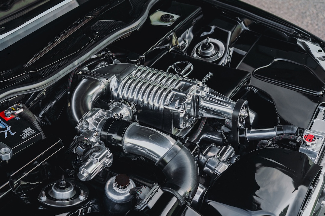 Supercharged 1UZ V8 in Kyle Harty’s 1999 Lexus GS 400 showing the ported Eaton M112 supercharger and modified Bullet Cars manifold.