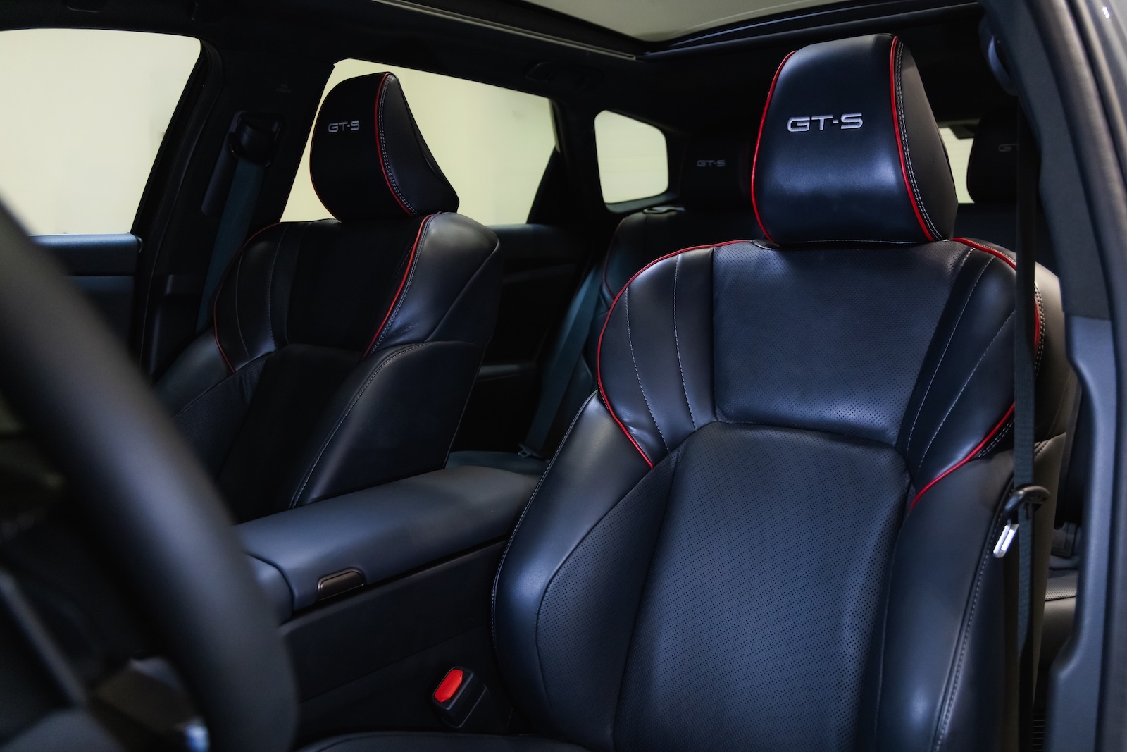 Interior of the Toyota Crown Signia GT-S Concept featuring black leather sport seats with red piping, contrast stitching and embroidered GT-S logos on the headrests.